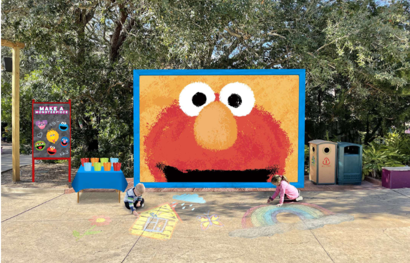 Children drawing with chalk in front of an Elmo mural