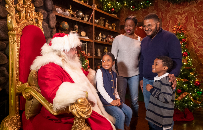 Santa on a chair with a family