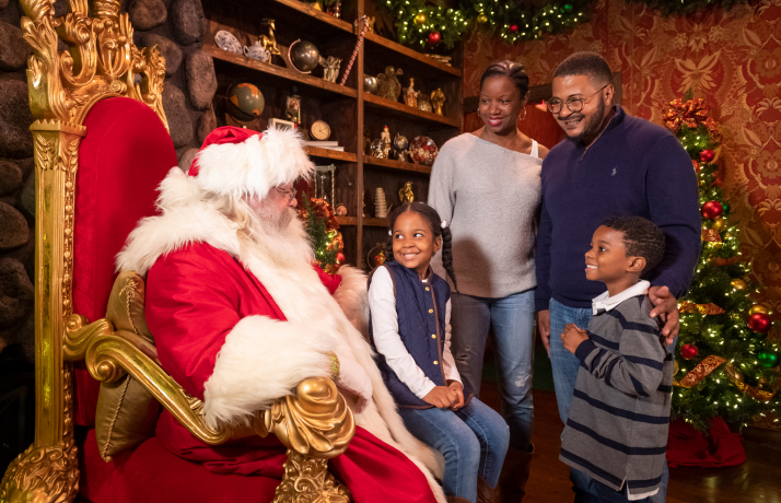 Family enjoying a Christmas Town Tour at Busch Gardens Williamsburg. 